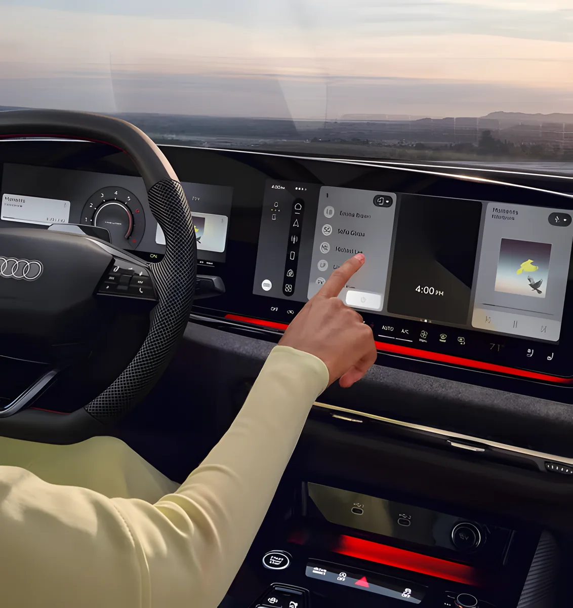 Driver tapping the MMI touch display beside the Audi A5 virtual cockpit