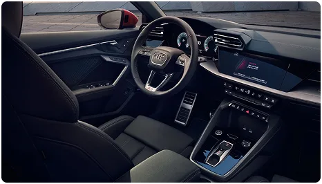 Audi A3 interior showing the steering wheel, digital displays and centre console