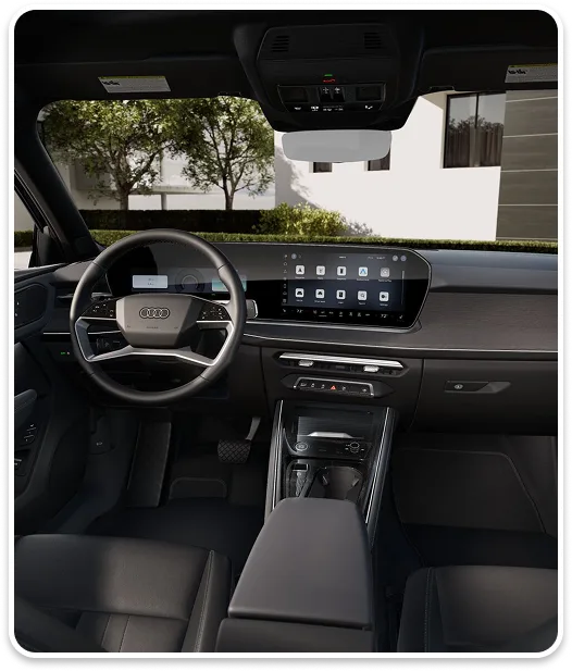 Audi Q3 cabin showing the steering wheel, displays and centre console
