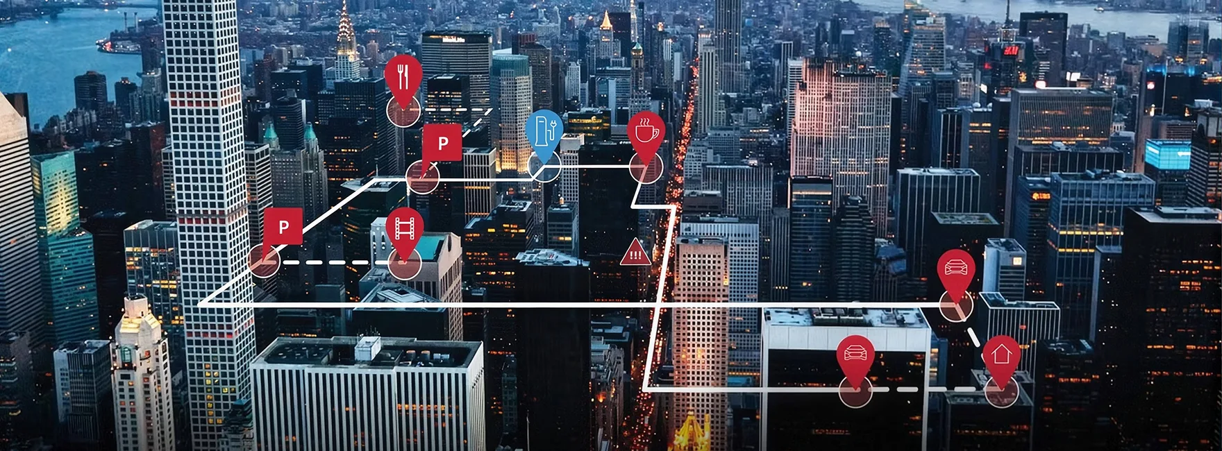 Night-time aerial view of a city overlaid with connected-vehicle data markers