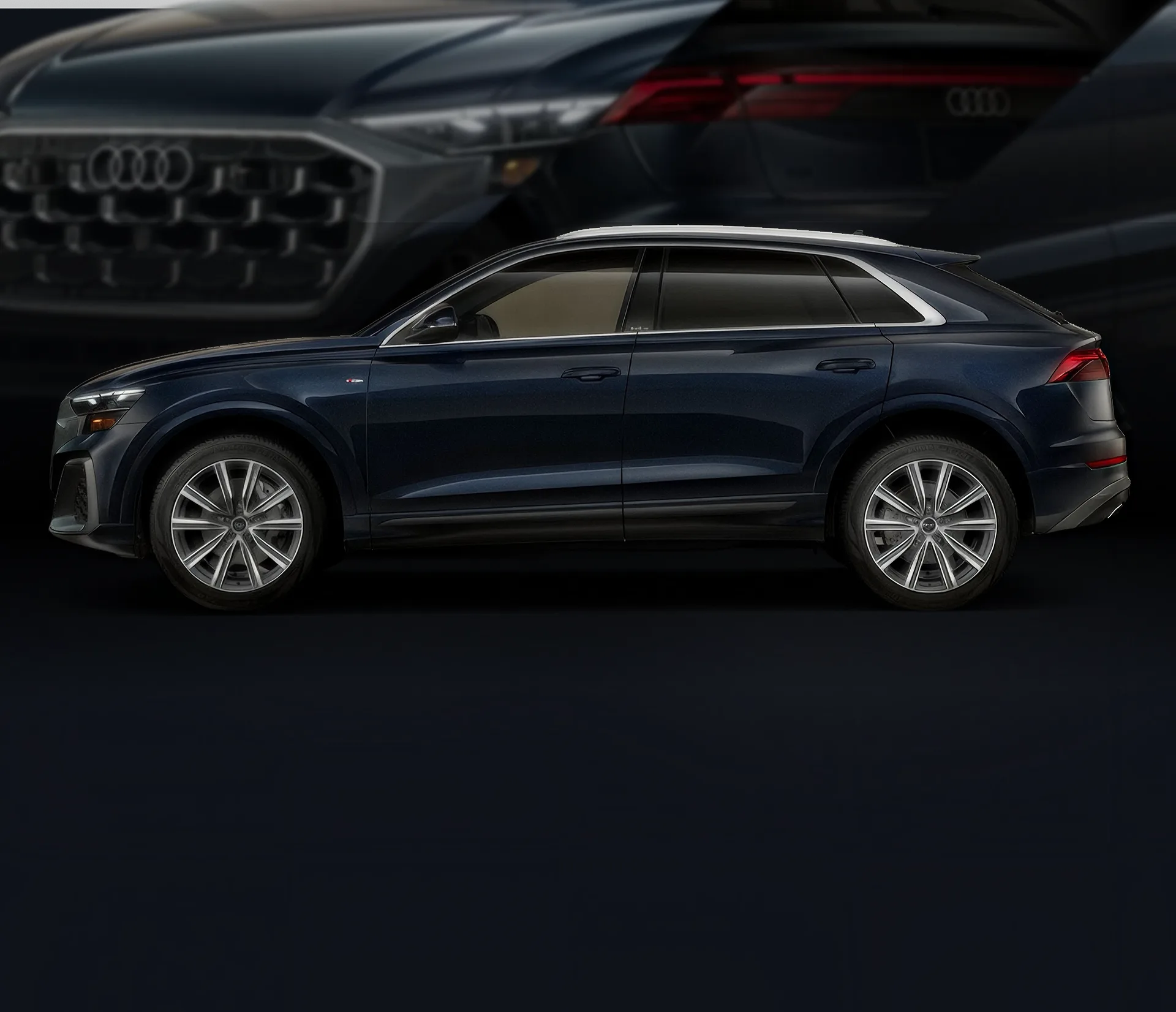 Blue Audi Q8 shown in profile against a dark backdrop of the same vehicle