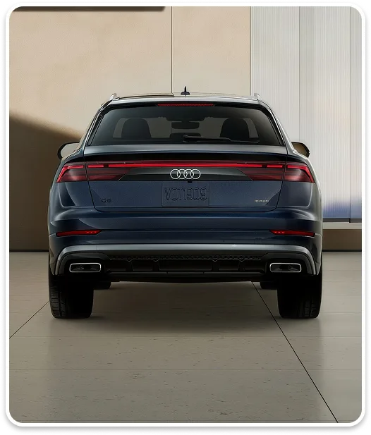 Rear view of a blue Audi Q8 showing its taillights and tailgate