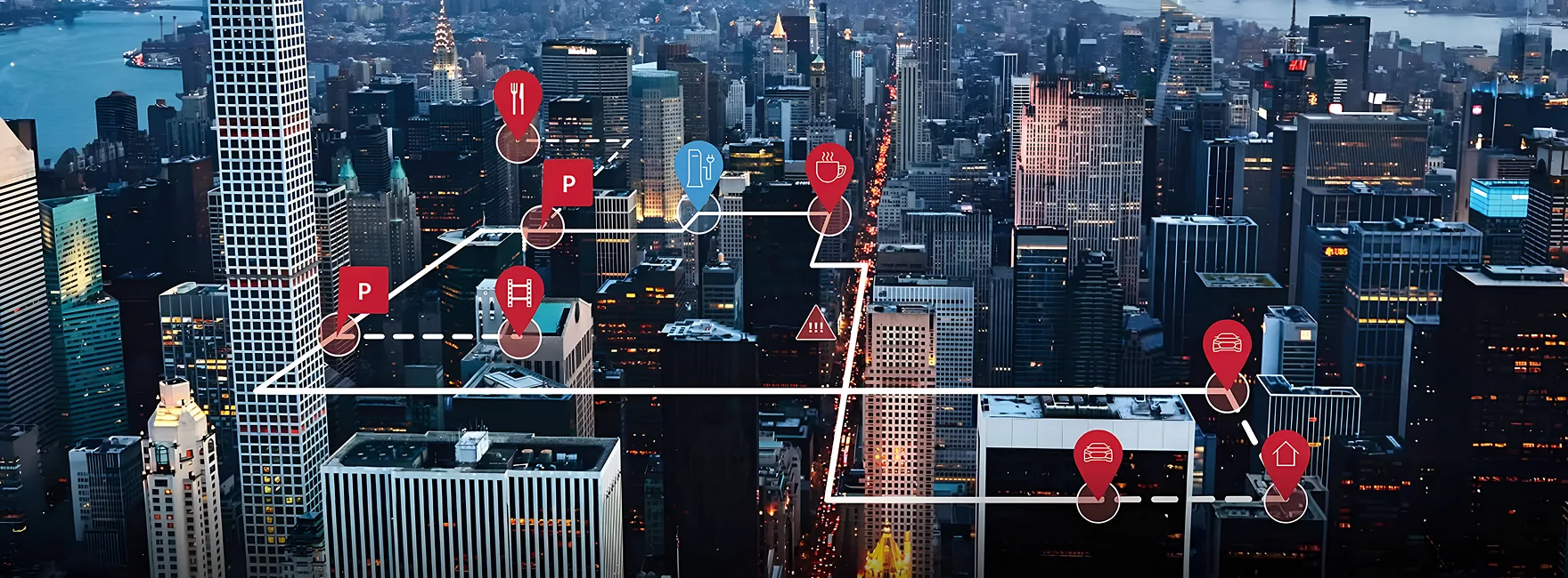 Night-time aerial view of a city overlaid with connected-vehicle data markers