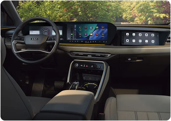 Audi Q5 front cabin with ventilated sport seats and the dashboard in daylight