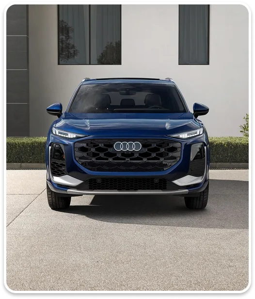 Front view of a blue Audi Q3 showing its Singleframe grille and headlights