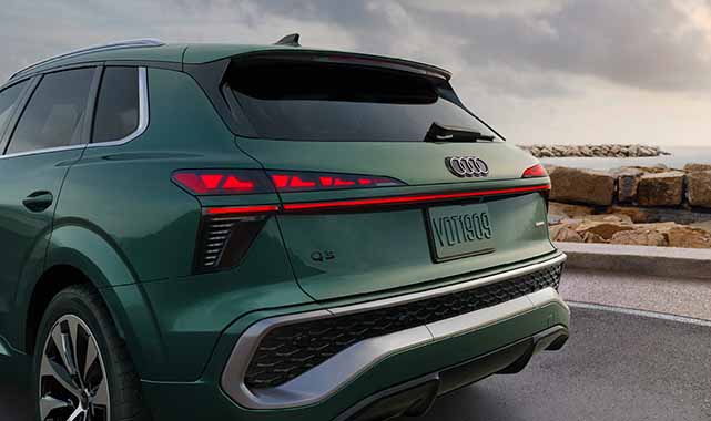 Rear view of a green Audi Q3 sleek taillight design and sporty rear bumper.