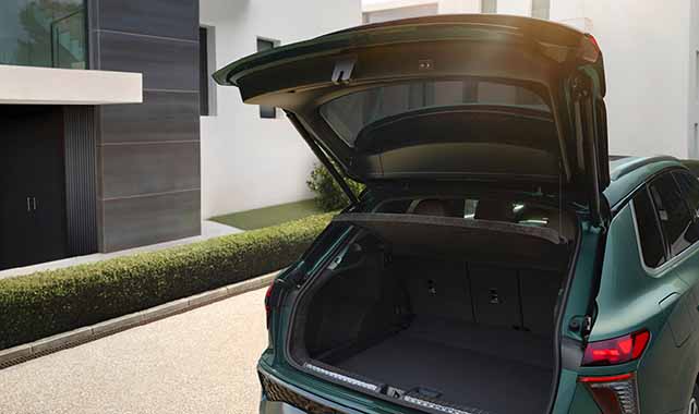 Rear hatch of the Audi Q3 spacious cargo area with foldable back seats.