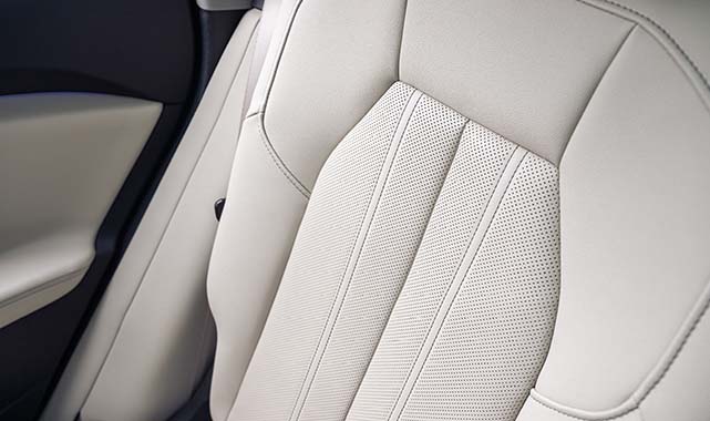 Close-up of 2025 Audi Q5's ivory leather seats featuring premium stitching.