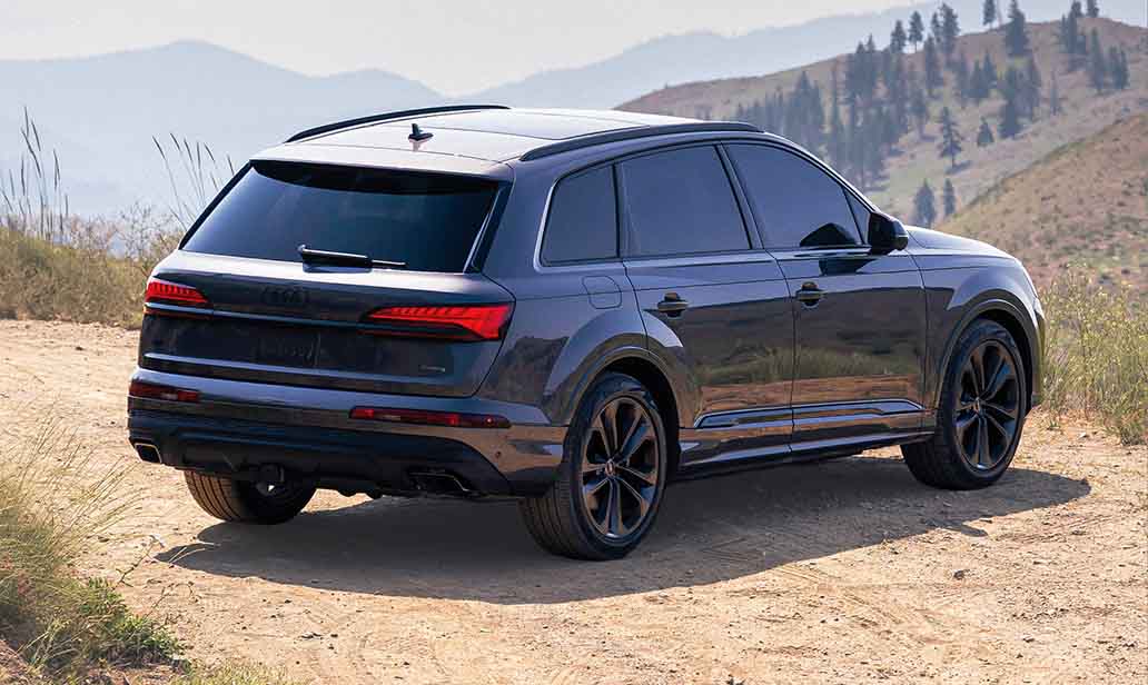 Rear view of the 2026 Audi Q7 overlooking mountains