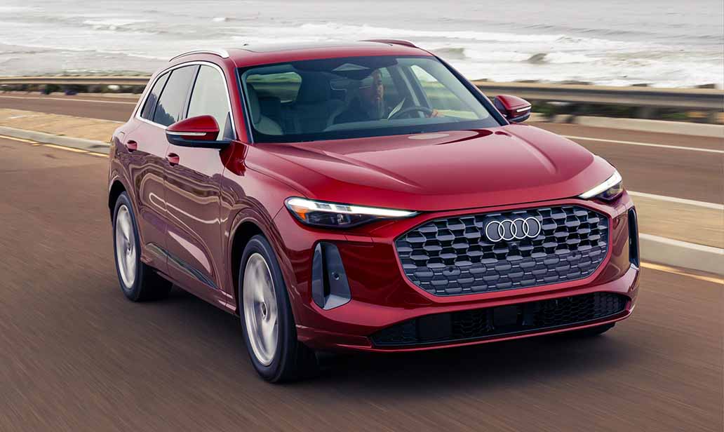 The all-new 2025 Q5 driving with coastal background