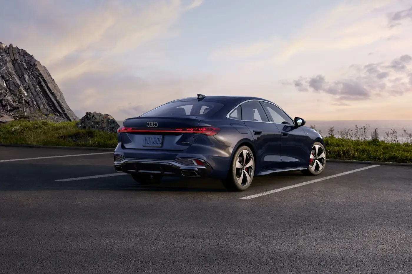 2027 Audi A5 rear three-quarter view showing the roofline and full-width LED light strip
