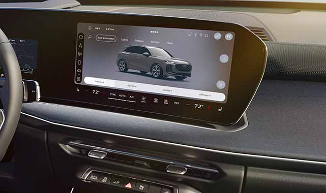 Audi Q3 digital cockpit widescreen infotainment interface with dual-zone climate controls.