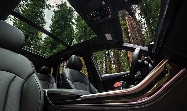 Interior view of the 2025 Audi A5 panoramic glass sunroof and perforated leather seats.
