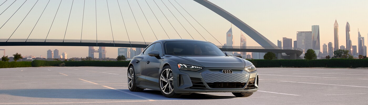 Audi e-tron GT Audi e-tron GT parked in front of a bridge