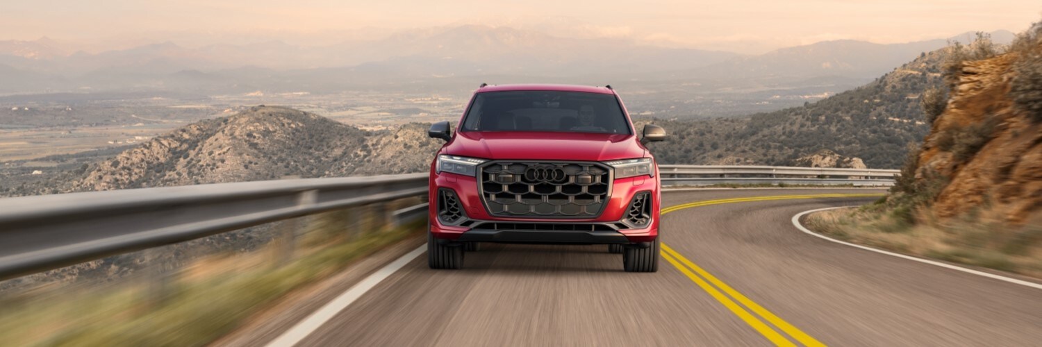 Audi SQ7 Audi SQ7 driving up a hill overlooking mountains