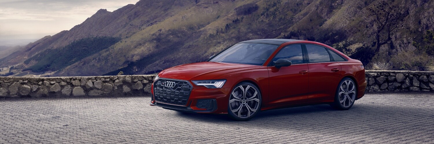 Audi S6 Red Audi S6 parked on cobble stone road