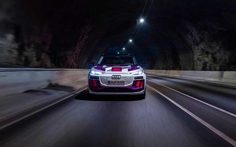 Front of the 2023 Audi Q6 e-tron on the road in a tunnel