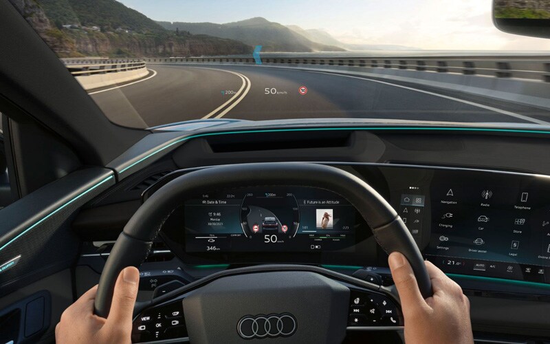 2025 Audi Q6 e-tron on a road in the mountains