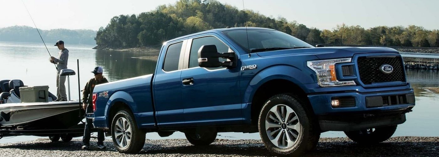 Blue F-150 Towing Boat
