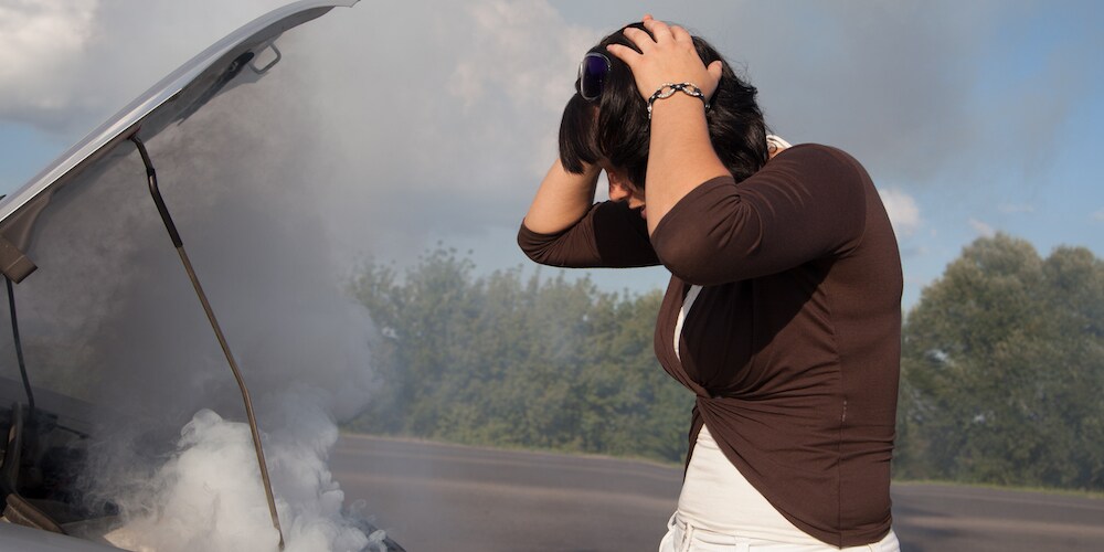 Woman Distraught Over Car Overheating