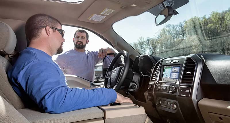 Men sitting in F-150 talking