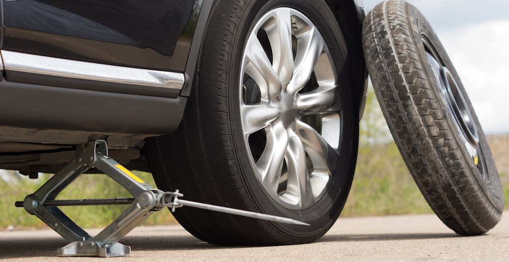 Car Jacked Up with Spare Tire