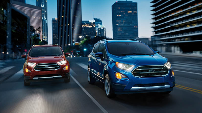 Ford EcoSport Models Driving with City Background