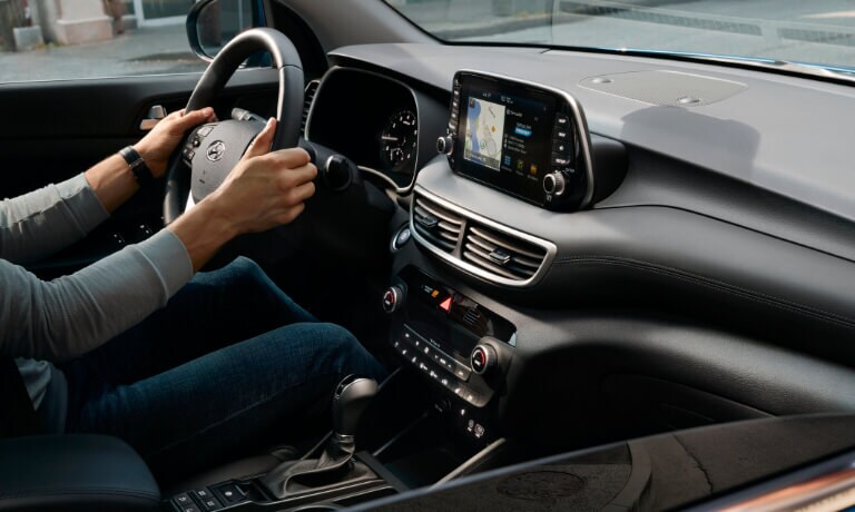 2020 Hyundai Tucson interior view of the front dash showing the touch screen and driver side