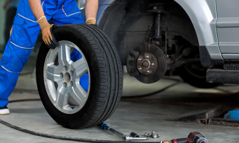 Technician removing tire