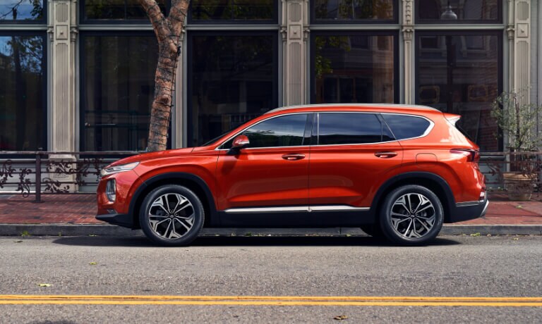 Orange 2020 Hyundai Tucson parked on the street