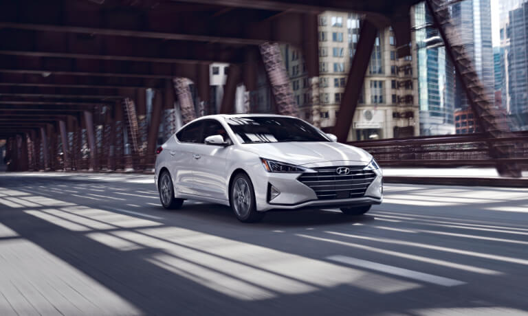 2020 Hyundai Elantra driving under a city bridge
