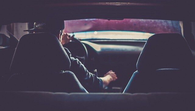 man driving car man in drivers seat of car