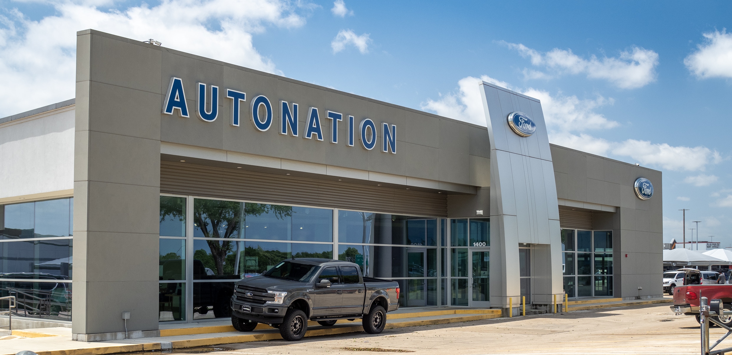 AutoNation Ford Arlington AutoNation Ford Arlington Exterior with Ford truck parked on the curb