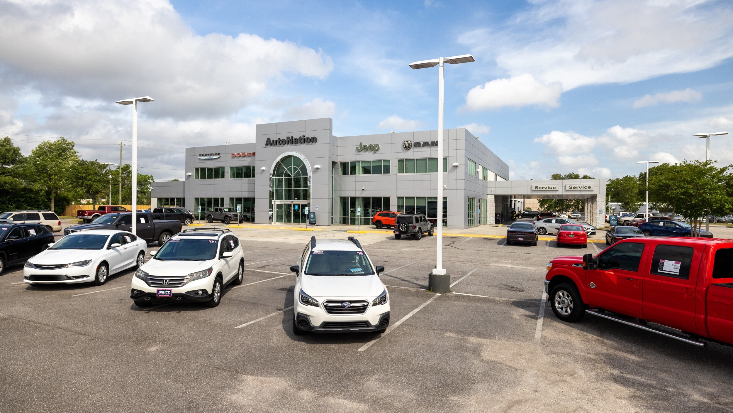Autonation Chrysler Dodge Jeep Ram Mobile is your Mobile, AL home for all your Chrysler, Dodge, Jeep, Ram financing, purchasing, and service needs Exterior view of Autonation Chrysler Dodge Jeep Ram Mobile during the day