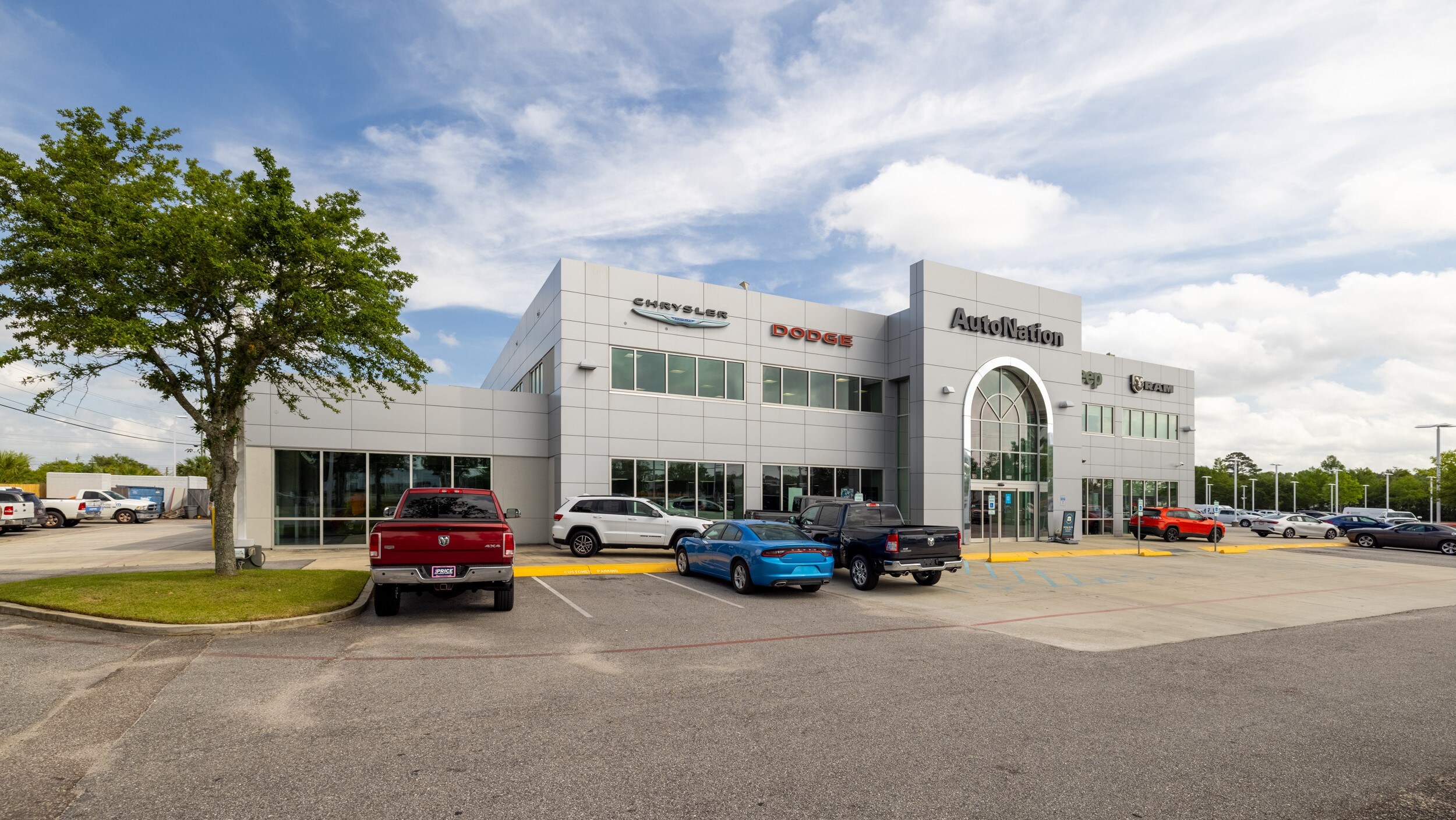 Autonation Chrysler Dodge Jeep Ram Mobile is your Mobile, AL home for all your Chrysler, Dodge, Jeep, Ram financing, purchasing, and service needs Exterior view of Autonation Chrysler Dodge Jeep Ram Mobile during the day