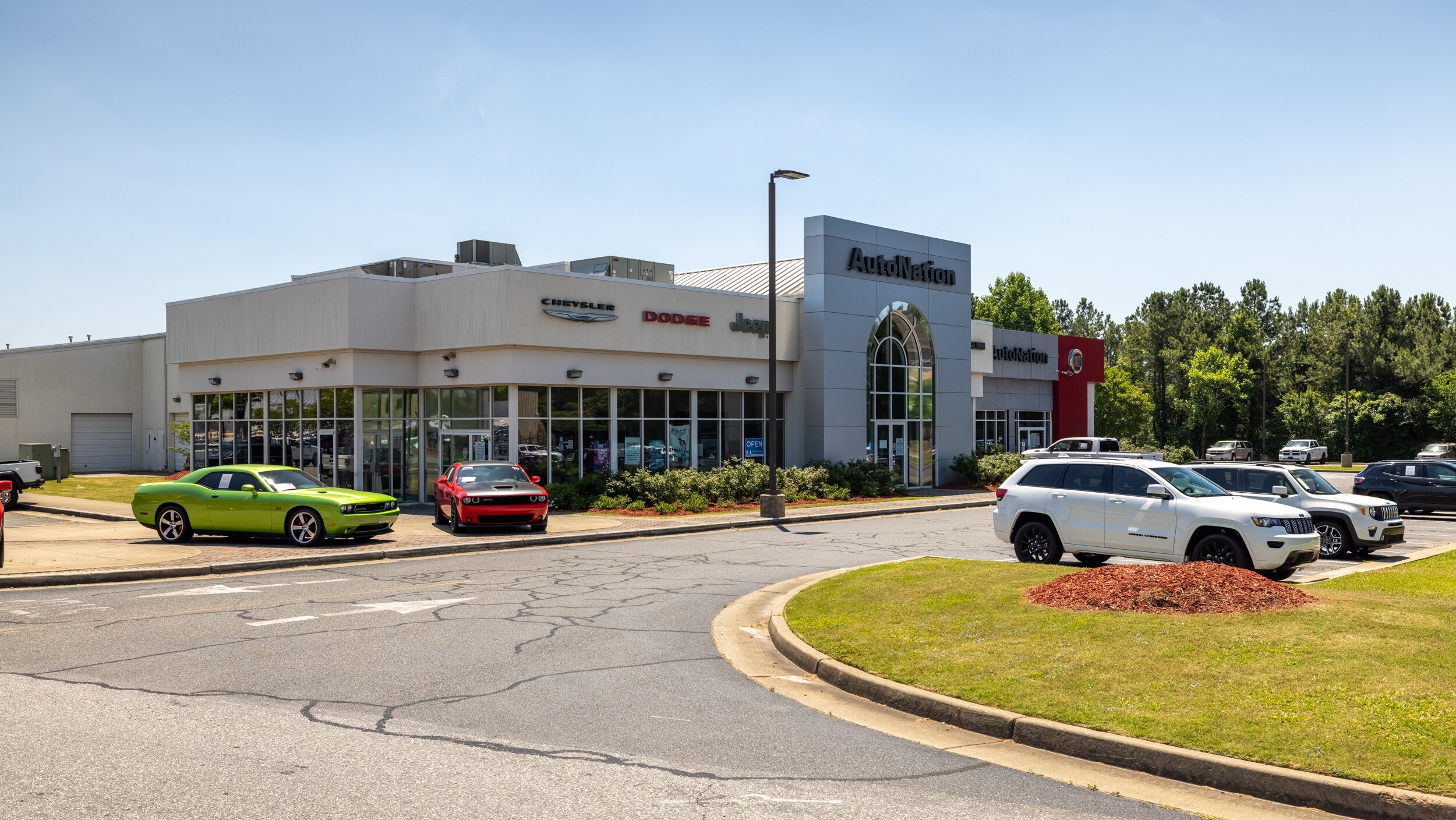 AutoNation Chrysler Dodge Jeep Ram & Fiat Columbus is your Columbus, GA home for all your Dodge, Jeep, FIAT, Chrysler, Ram financing, purchasing, and service needs Exterior view of AutoNation Chrysler Dodge Jeep Ram & Fiat Columbus during the day