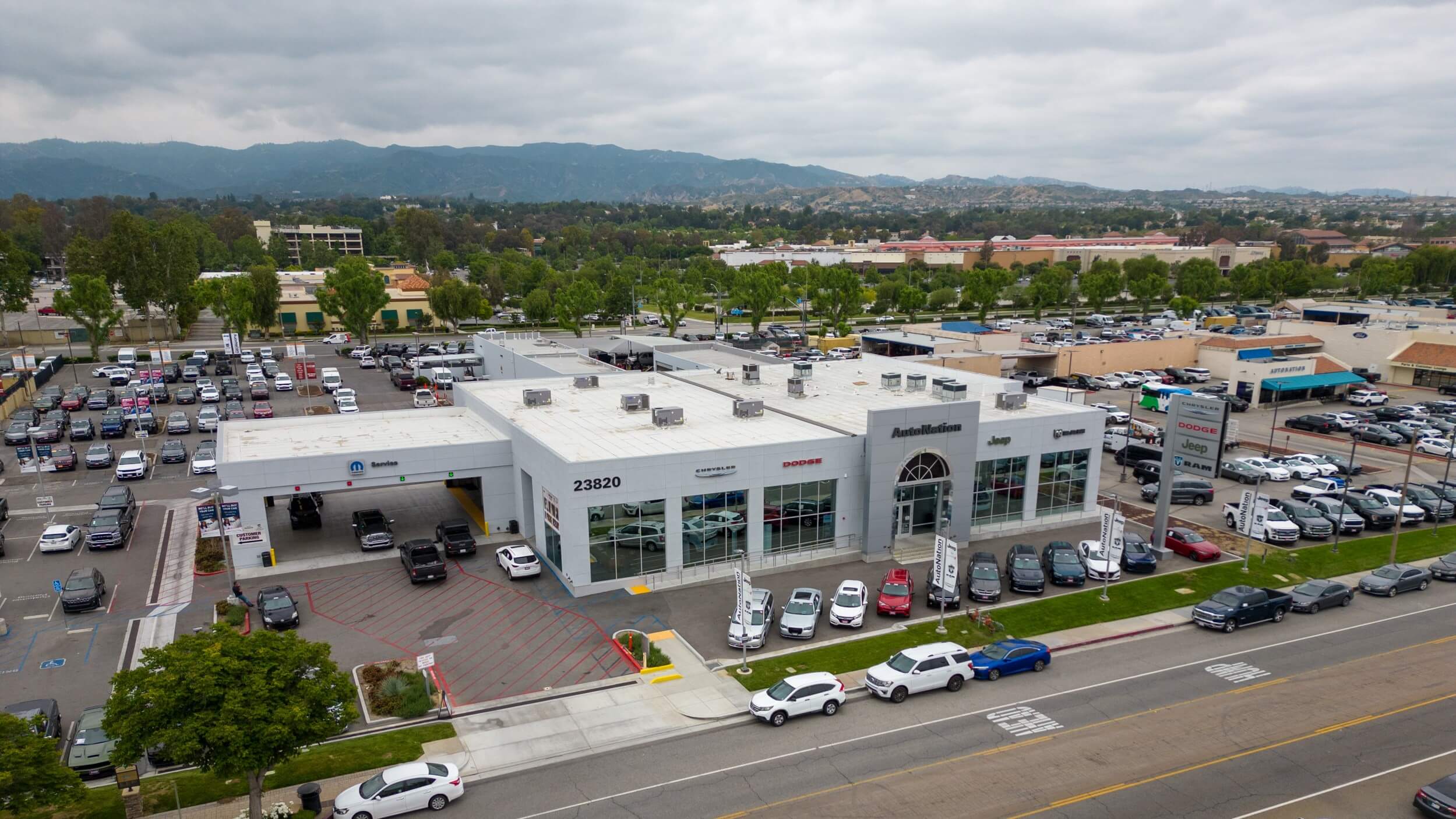 Find a great car, truck, or SUV at Chrysler Dodge Jeep RAM Valencia Exterior view, shot from a drone of Chrysler Dodge Jeep RAM Valencia, showing full layout of the dealership