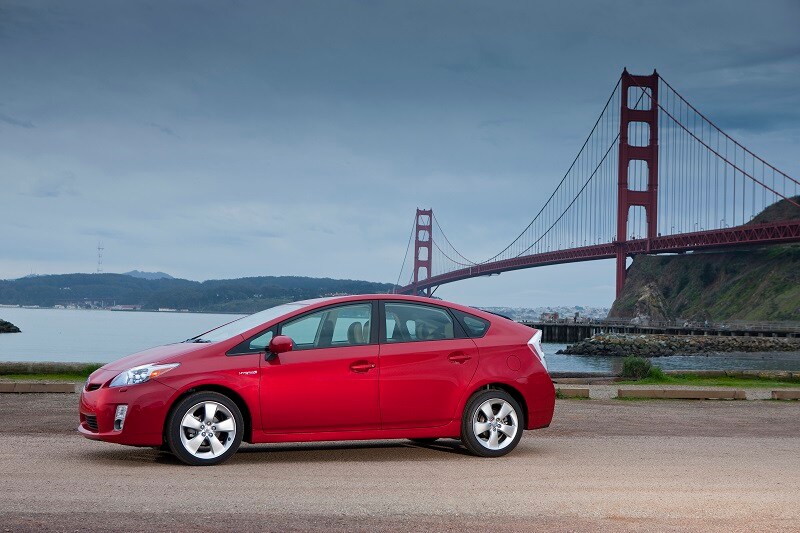 Get a recommendation of used cars under $10,000 Image of a Toyota Prius near the Golden Gate Bridge