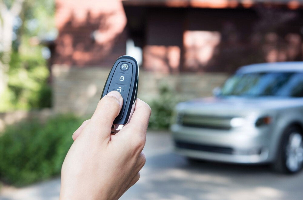 Learn more about Keyless Entry and Remote Start Image of a hand holding a key fob for a vehicle