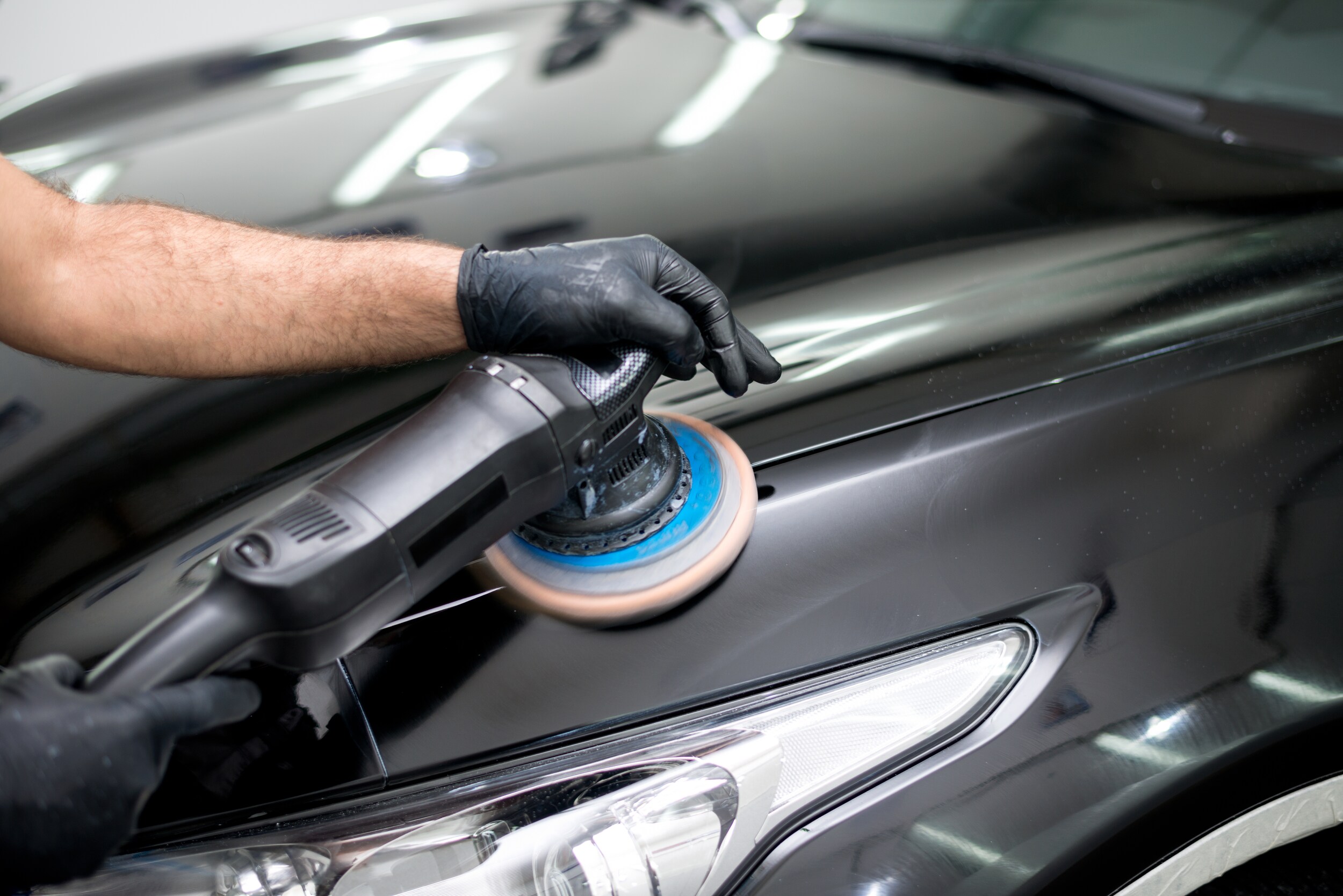 Certified Technicians | AutoNation Ford Torrance Car buffer buffing out scratches.