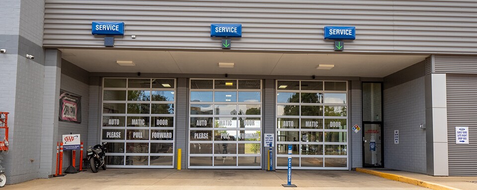 Ford Service Center near Denver Exterior view of garage doors at AutoNation Ford Littleton dealer