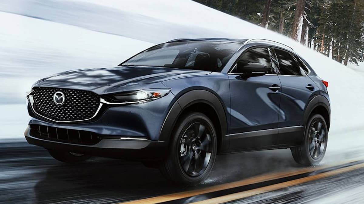 Mazda CX-30 driving through snow with Mazda i-ACTIV AWD
