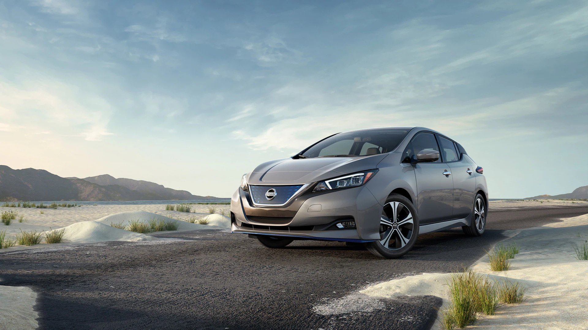 Learn more about Nissan EVs at AutoNation Nissan Las Vegas Gray Nissan Leaf driving in the desert