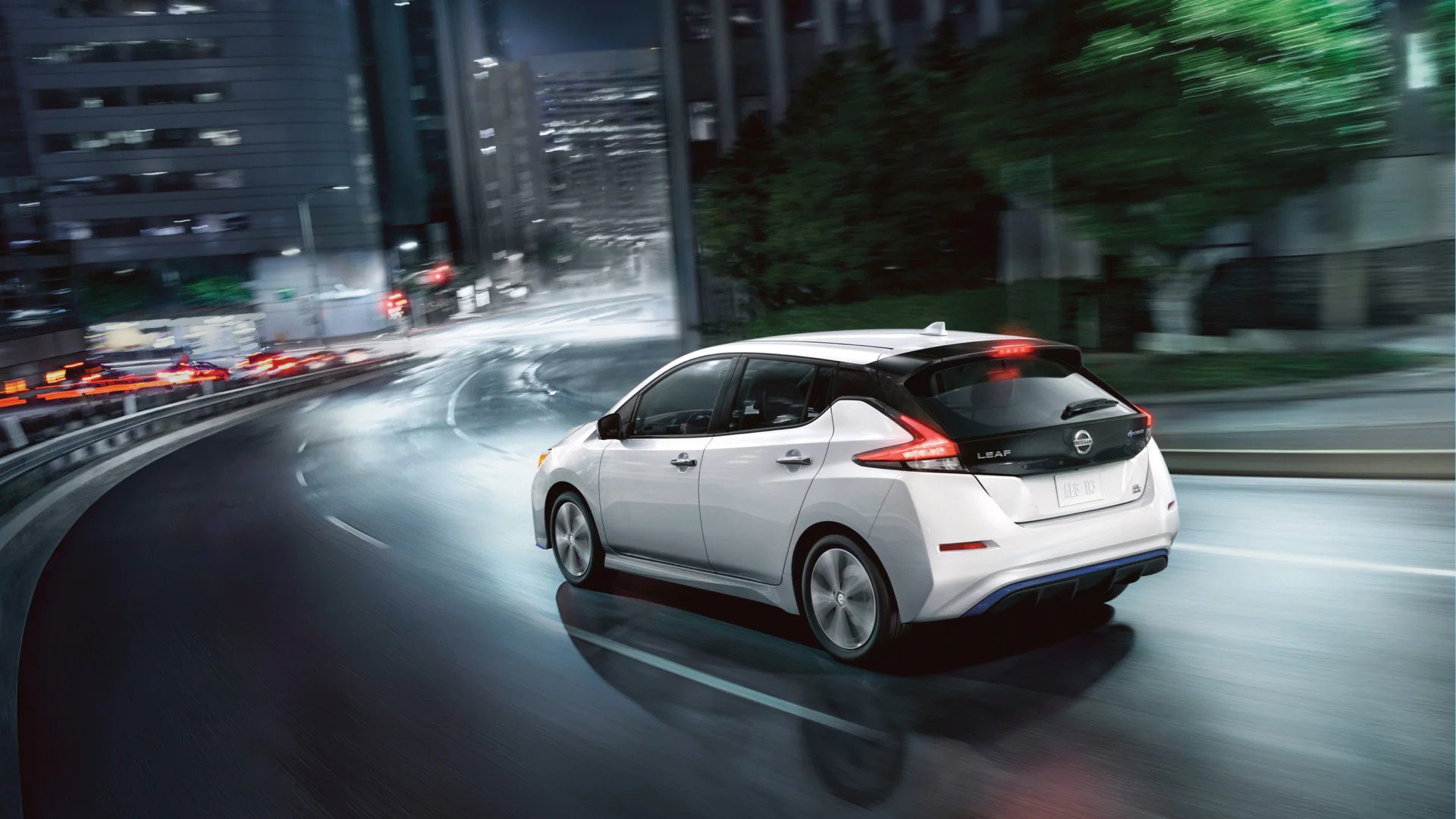 New Nissan LEAF available at AutoNation Nissan Memphis Nissan LEAF driving in the city at night