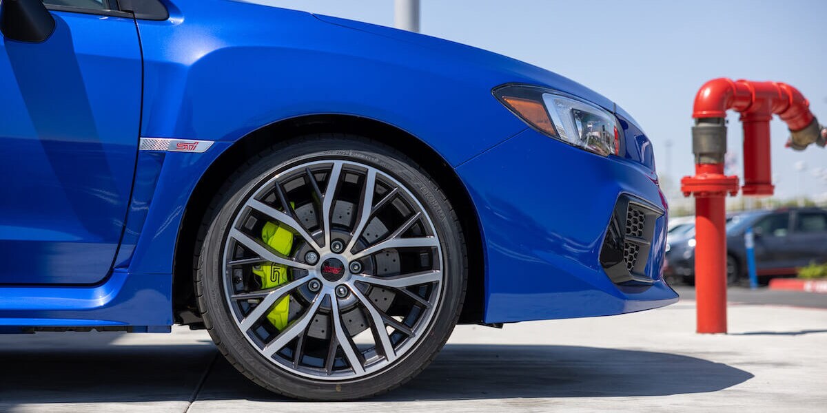 Side view of a blue Subaru WRX STI
