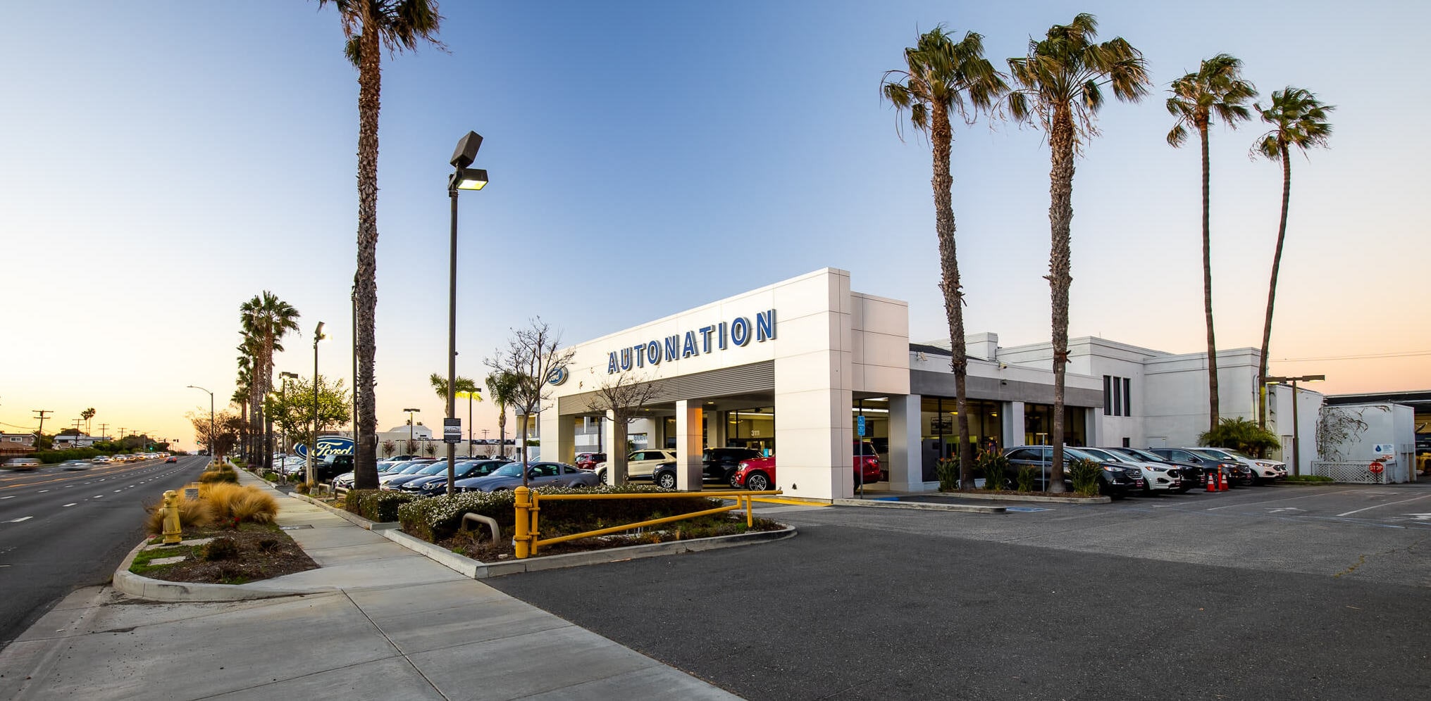 AutoNation Ford Torrance Ford Torrance dealershipwithpalm trees and sunset