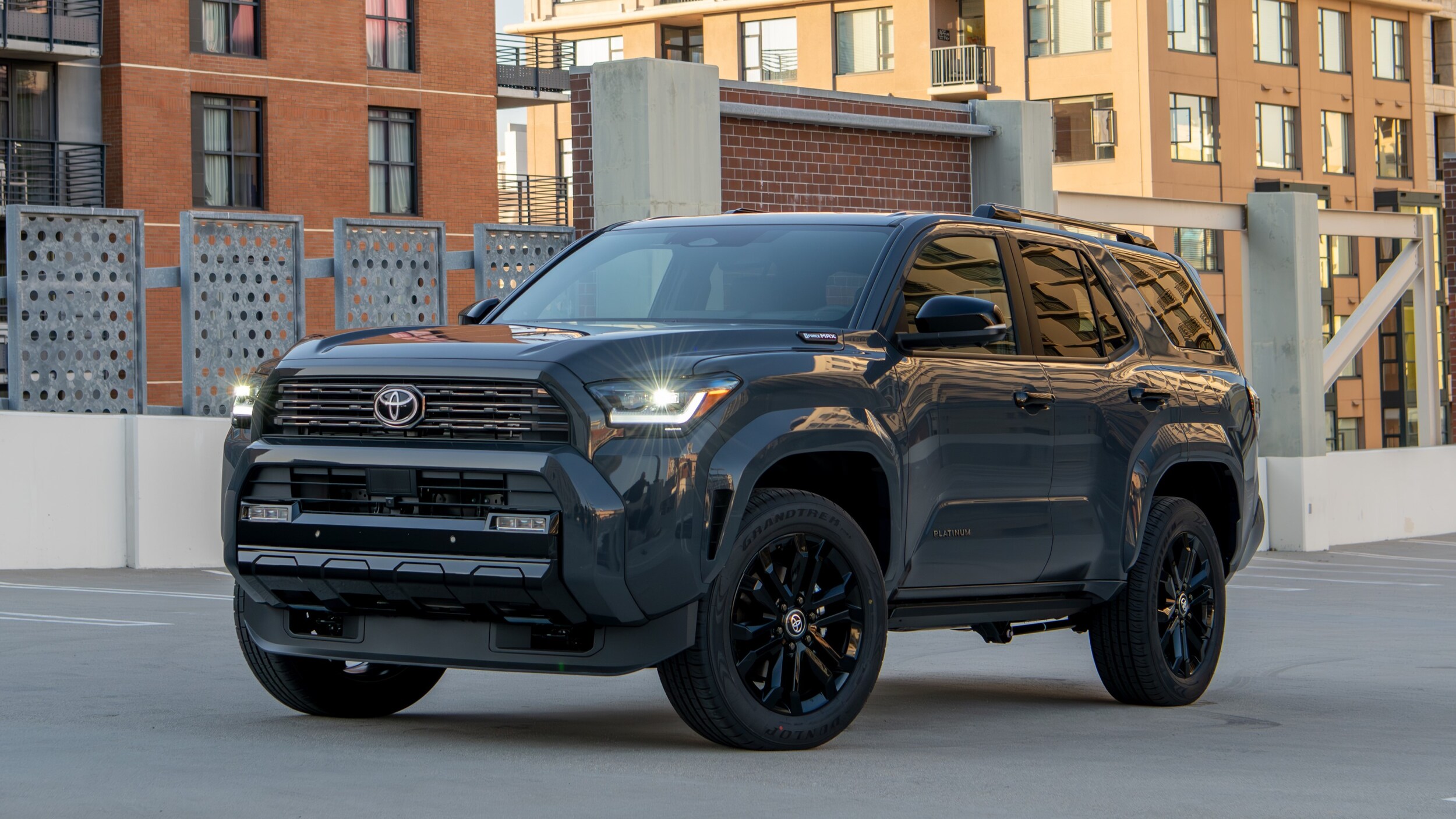 A Toyota 4Runner sitting in a city parking lot.