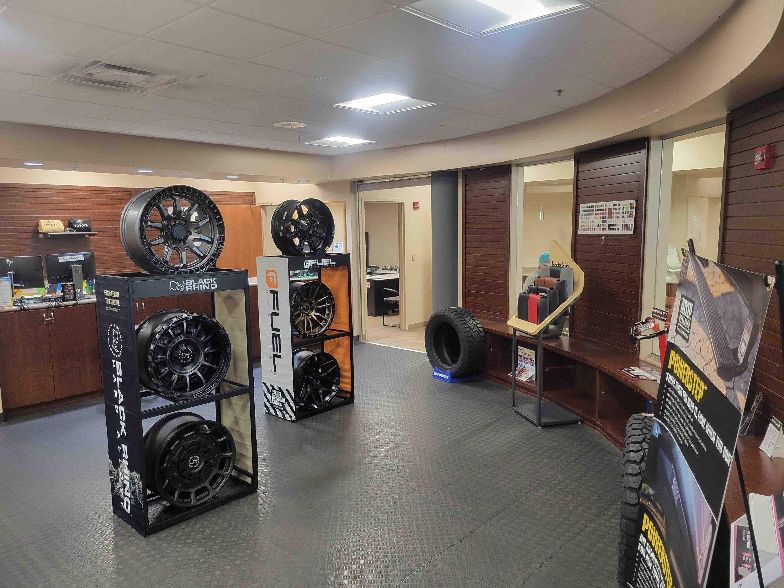 Order genuine Toyota parts at AutoNation Toyota Fort Myers View of the
parts counter at AutoNation Toyota Fort Myers. Tires, wheels, and various vehicle accessories can be seen on display for purchase.
