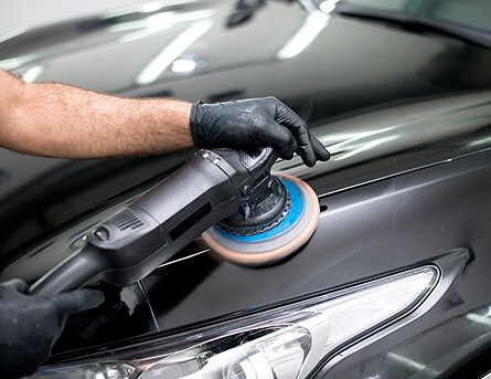 AutoNation Collision Repair Services Car buffer buffing out scratches.