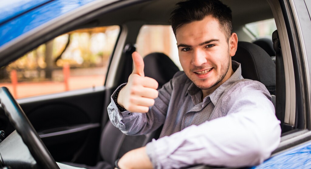 happy-smiling-man-sitting-inside-car-showing-thumbs-up-handsome-guy-excited-about-his-new-vehicle-positive-face-expression.jpg